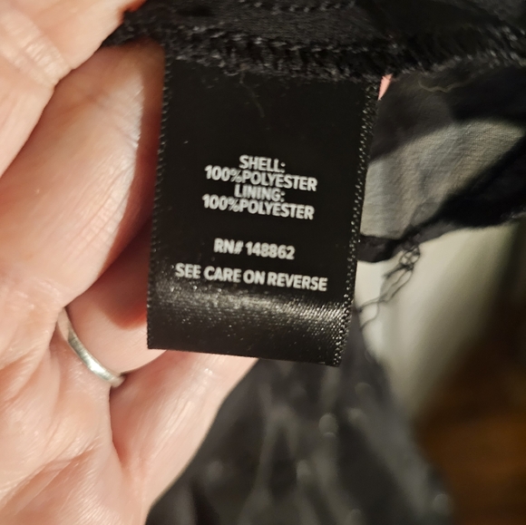 Torrid Black long wrap blouse with star print. - Picture 8 of 9